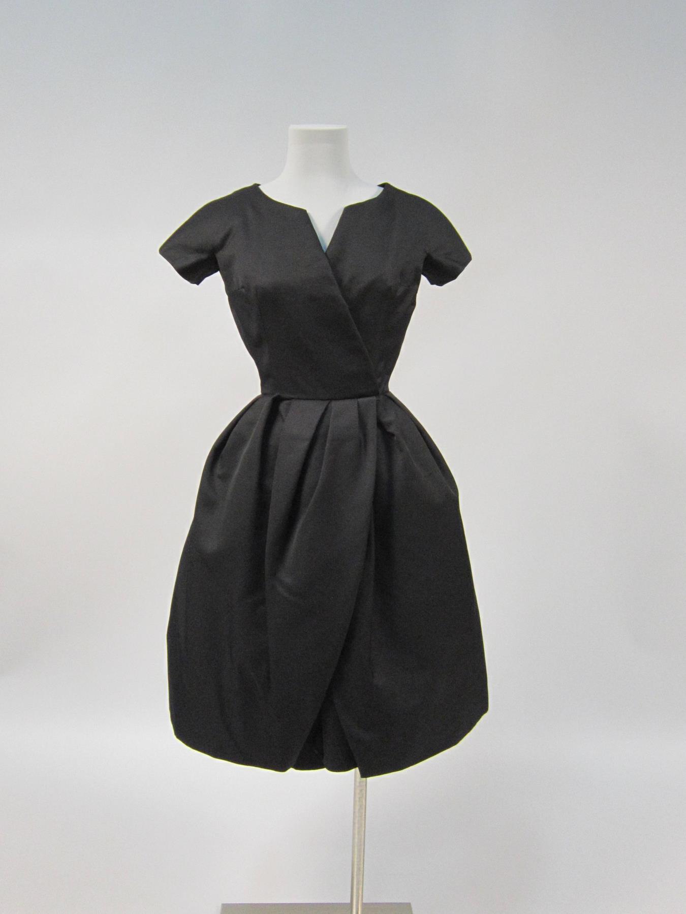 Image of Woman's black alpaca wool cocktail dress with underskirt, 1956